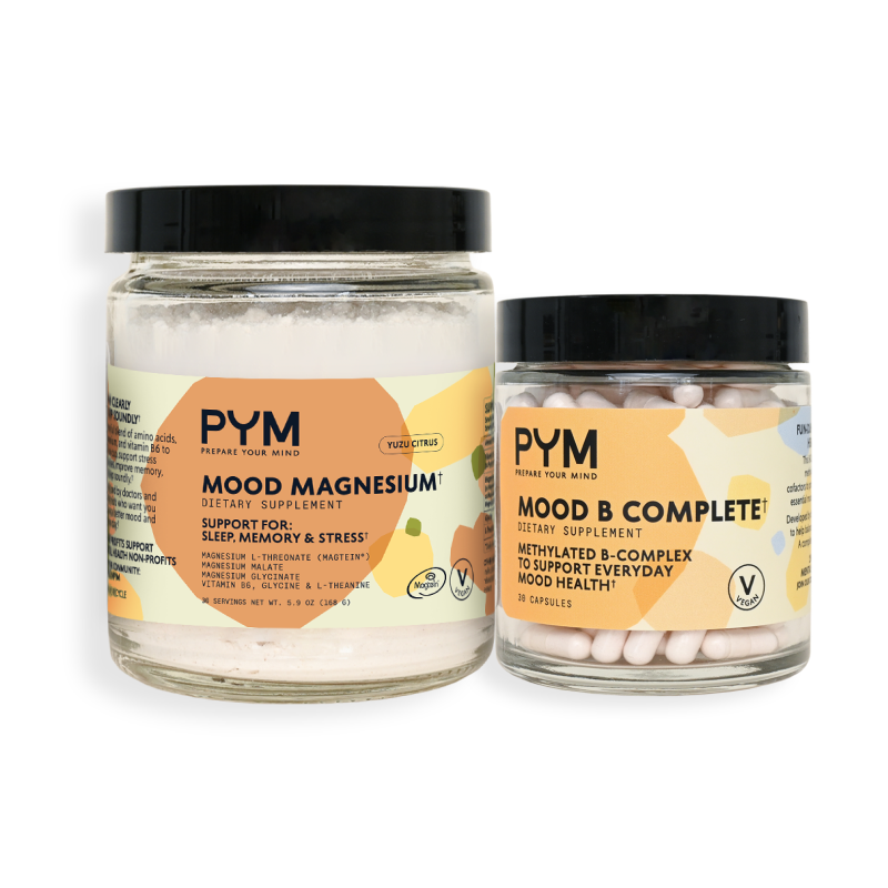 Two jars of PYM dietary supplements: Mood Magnesium dietary supplement supporting sleep, memory, and stress, and Mood B Complete methylated B-complex to support everyday mood health, both labeled vegan and featuring yuzu citrus flavor.