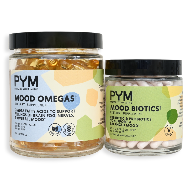 Two jars of PYM dietary supplements: Mood Omegas with omega fatty acids to support feelings of brain fog, nerves, and overall mood, and Mood Biotics with prebiotic and probiotics to support a balanced mood. Labels include natural, gluten-free, and vegan icons.