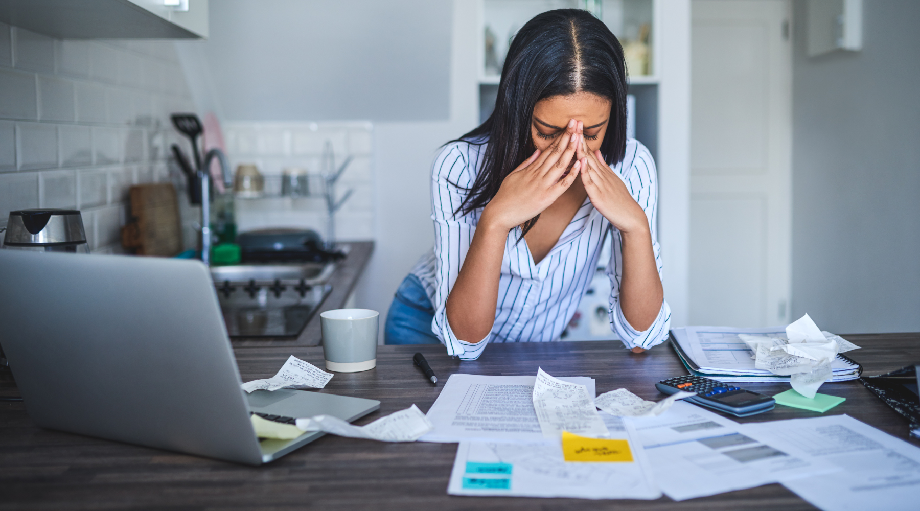 Woman looking stressed doing her taxes